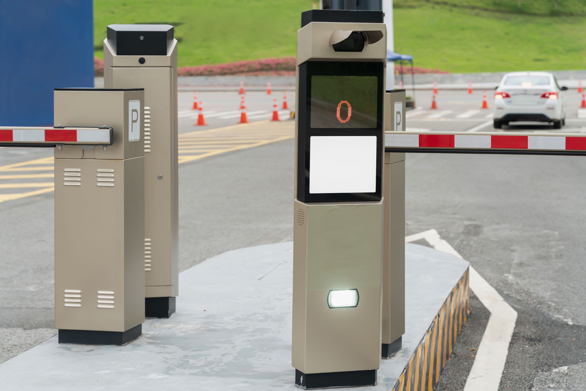 Closeup of an automatic gate barrier at a car park with copy space