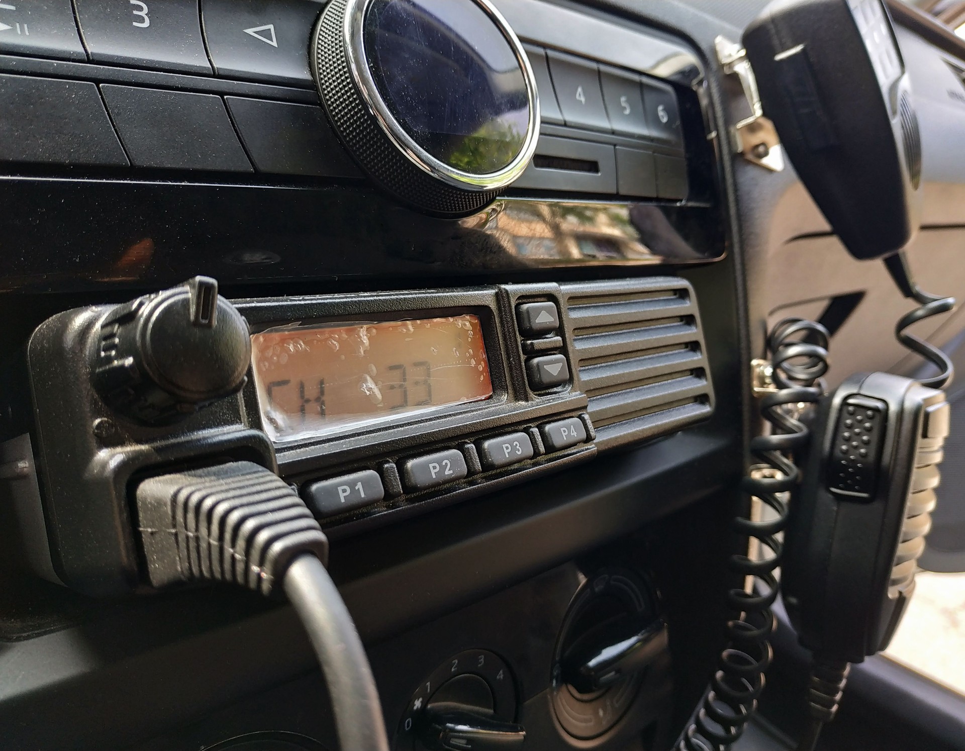 Police patrol car radio equipment and microphone. Walkie-talkie. Selective focus.